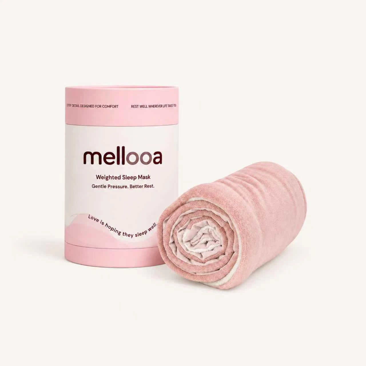 Mellooa Blush Pink weighted sleep mask rolled beside its product package