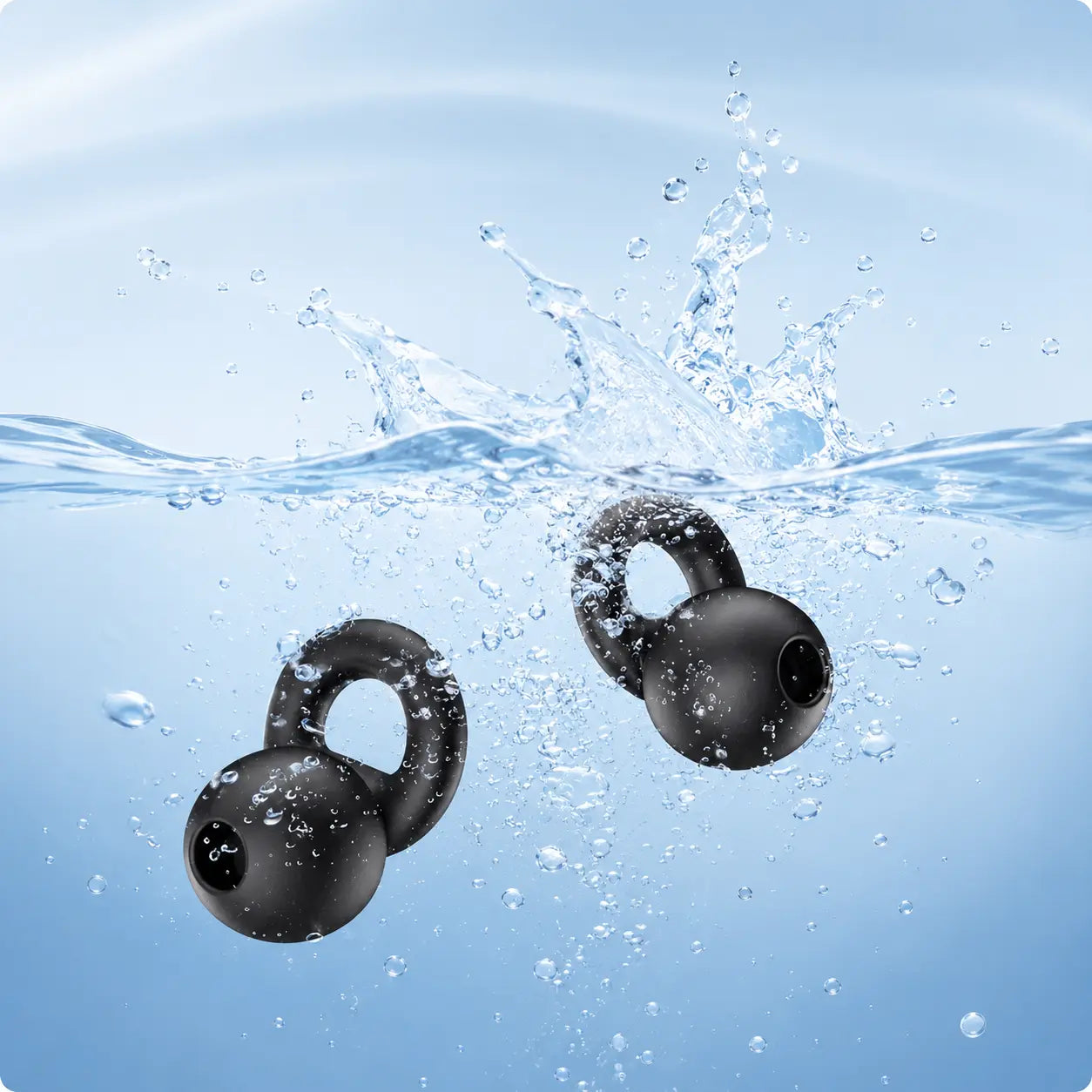 Washable reusable silicone earplugs being rinsed in water