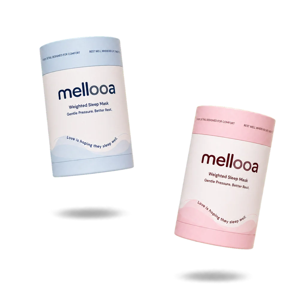 Blue Mellooa gift box floating higher on the left and blush pink box lower on the right with separate soft shadows