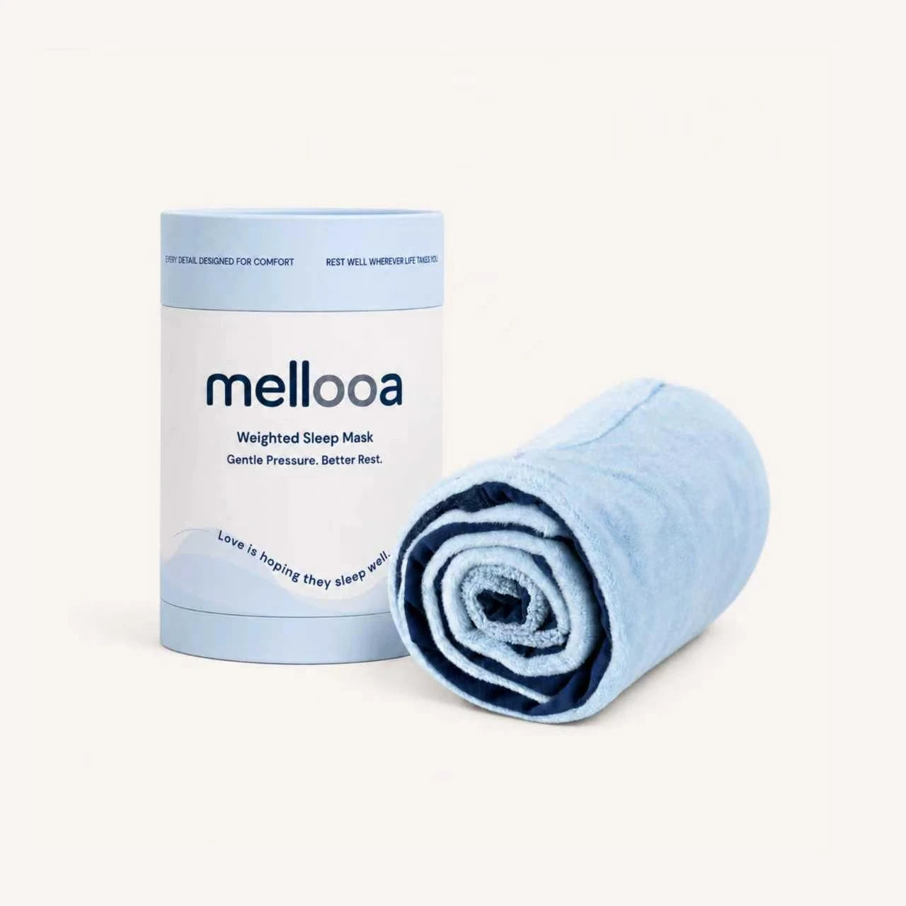 Mellooa Navy weighted sleep mask rolled beside its product package