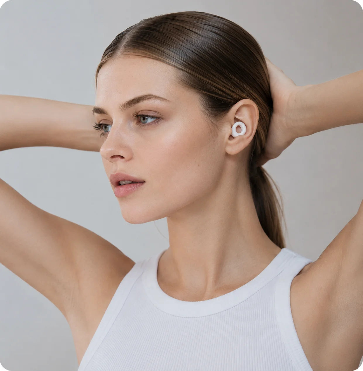 Cloud White silicone earplugs worn for everyday focus